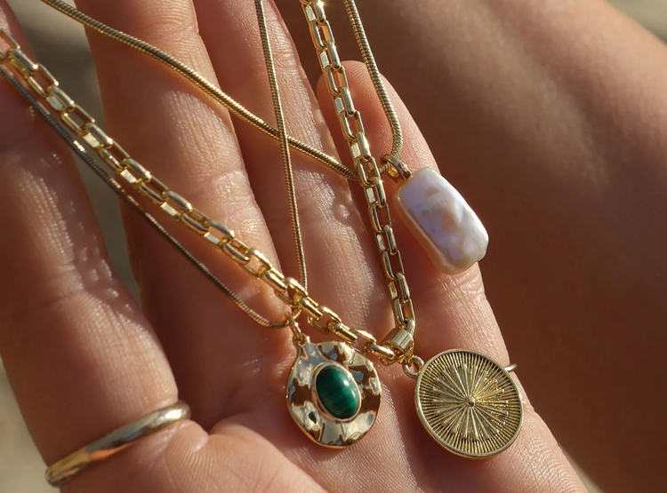 Handcrafted jewellery by Tide & Stone — moss agate beaded necklace and gold spiral huggie earrings