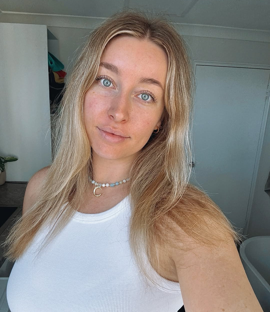 Woman wearing handcrafted gold-filled necklace - Tide & Stone Jewellery Australia